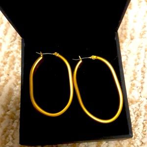 Brushed gold tone twisted hoop earrings (not real gold)